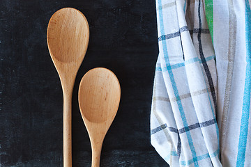 Image showing wooden spoons and tablecloth