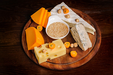 Image showing various cheeses with nuts and fruits