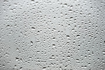 Image showing Natural water drops on glass