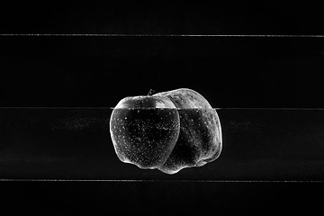 Image showing Small apple in see trough water