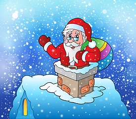 Image showing Santa Claus on snowy roof