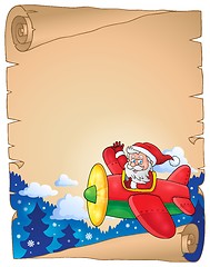 Image showing Parchment with Santa Claus in plane