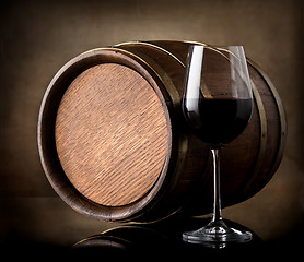 Image showing Red wine and a wooden barrel