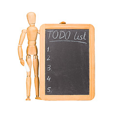 Image showing Wooden dummy with chalkboard todo list