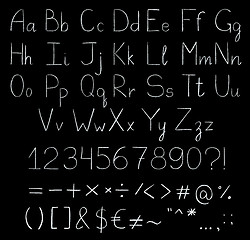 Image showing Chalkboard alphabet isolated on black.