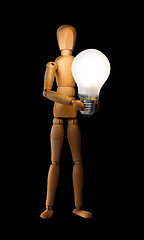 Image showing Wooden mannequin holding light bulb