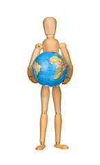 Image showing Wooden model dummy holding globe.