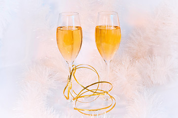 Image showing Two glasses of wine and tinsel