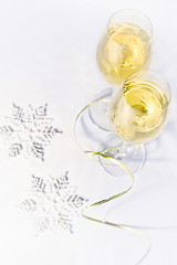 Image showing Two glasses of wine and snowflakes