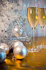 Image showing Christmas tree, toy balloons and glasses of wine