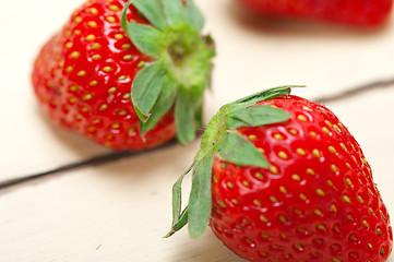 Image showing fresh organic strawberry over white wood