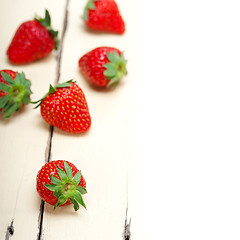 Image showing fresh organic strawberry over white wood