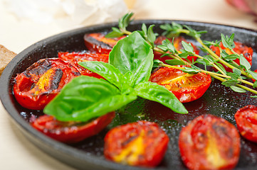 Image showing baked cherry tomatoes with basil and thyme