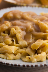 Image showing homemade pumpkin tagliatelle with mushrooms