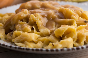 Image showing homemade pumpkin tagliatelle with mushrooms