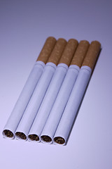 Image showing Isolated Cigarettes Under Blue Light