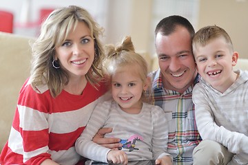 Image showing happy young family at home