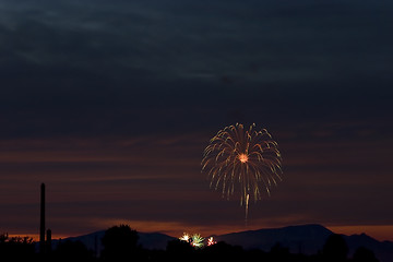 Image showing Firecrackers In The Sky During Sunset