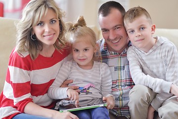 Image showing happy young family at home