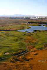 Image showing Overlooking at a Golf Course and a Pond