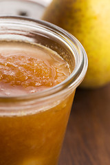 Image showing glass of pear jam with orange