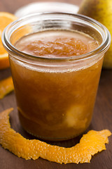 Image showing glass of pear jam with orange