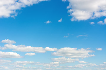 Image showing Cumulus clouds in a bright blue sky.