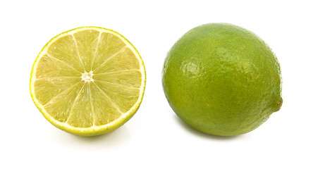 Image showing Whole fresh lime and cut half fruit