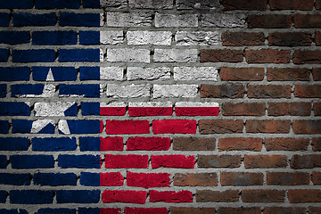 Image showing Brick wall texture with flag