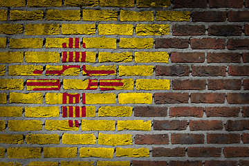 Image showing Brick wall texture with flag