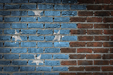 Image showing Brick wall texture with flag