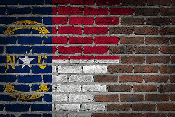 Image showing Brick wall texture with flag