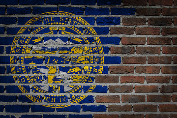 Image showing Brick wall texture with flag