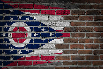 Image showing Brick wall texture with flag