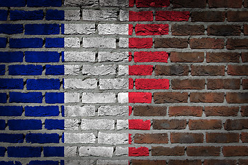 Image showing Brick wall texture with flag