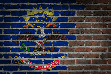 Image showing Brick wall texture with flag