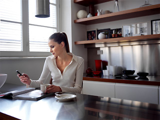 Image showing middle woman and kitchen