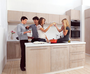 Image showing four friends preparing dinner