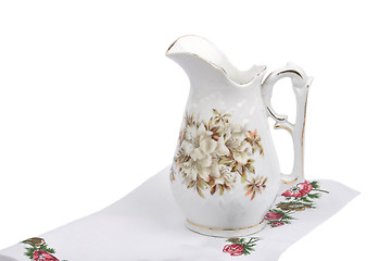 Image showing Old flower vase on cloth