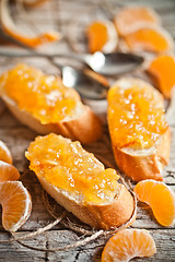 Image showing pieces of baguette with orange marmalade