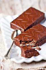 Image showing dark chocolate cakes and spoon