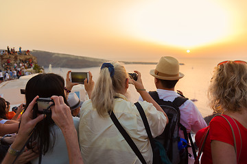 Image showing Trvellers watching sunset in Oia, Santorini, Greece.