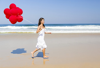 Image showing Girl with red balloons