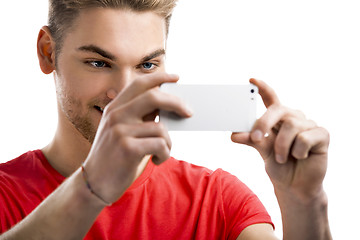 Image showing Young man taking a selfie