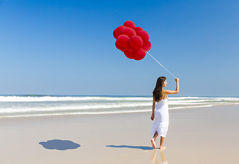 Image showing Girl with red balloons