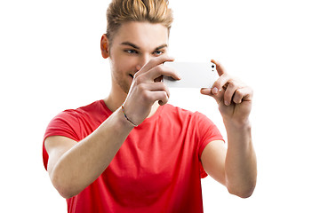 Image showing Young man taking a selfie