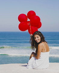 Image showing Girl with red balloons