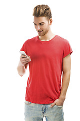 Image showing Young man texting