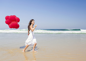 Image showing Girl with red balloons