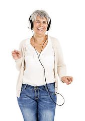 Image showing Elderly woman listen music